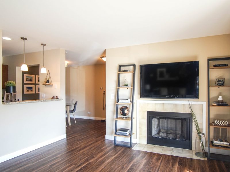 This image shows an alternative view of the Premium Apartment Feature, especially the living room area showcasing a fireplace and a spacious area that was bringing a pleasant ambiance.